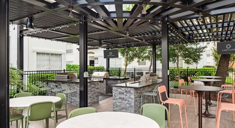 Outdoor Kitchen with Gas Grills at Our Apartments Near River Oaks in Houston