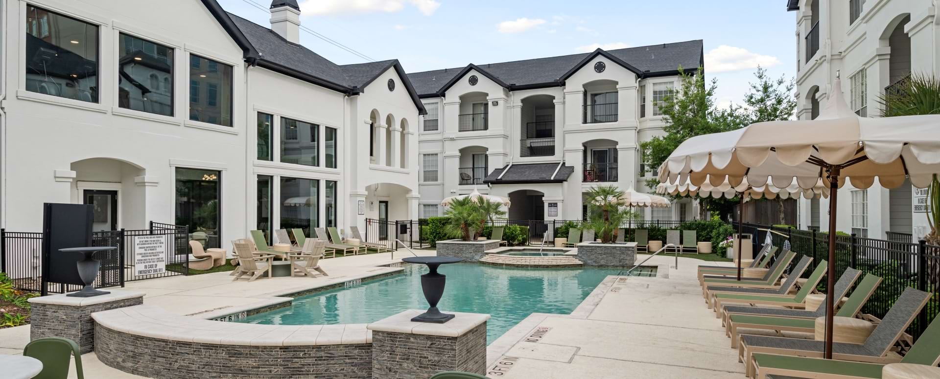 Resort-Style Pool with Lounge Chairs at Our Allen Parkway Apartments in Houston