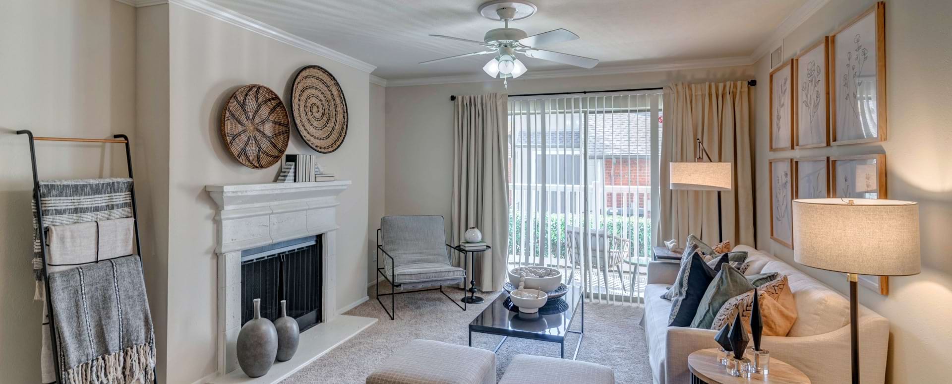 Living Room with a Ceiling Fan at Our Apartments Near Las Colinas, TX