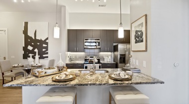 Modern Kitchen Lighting and Granite Countertops at Our Apartments By Northlake Mall 