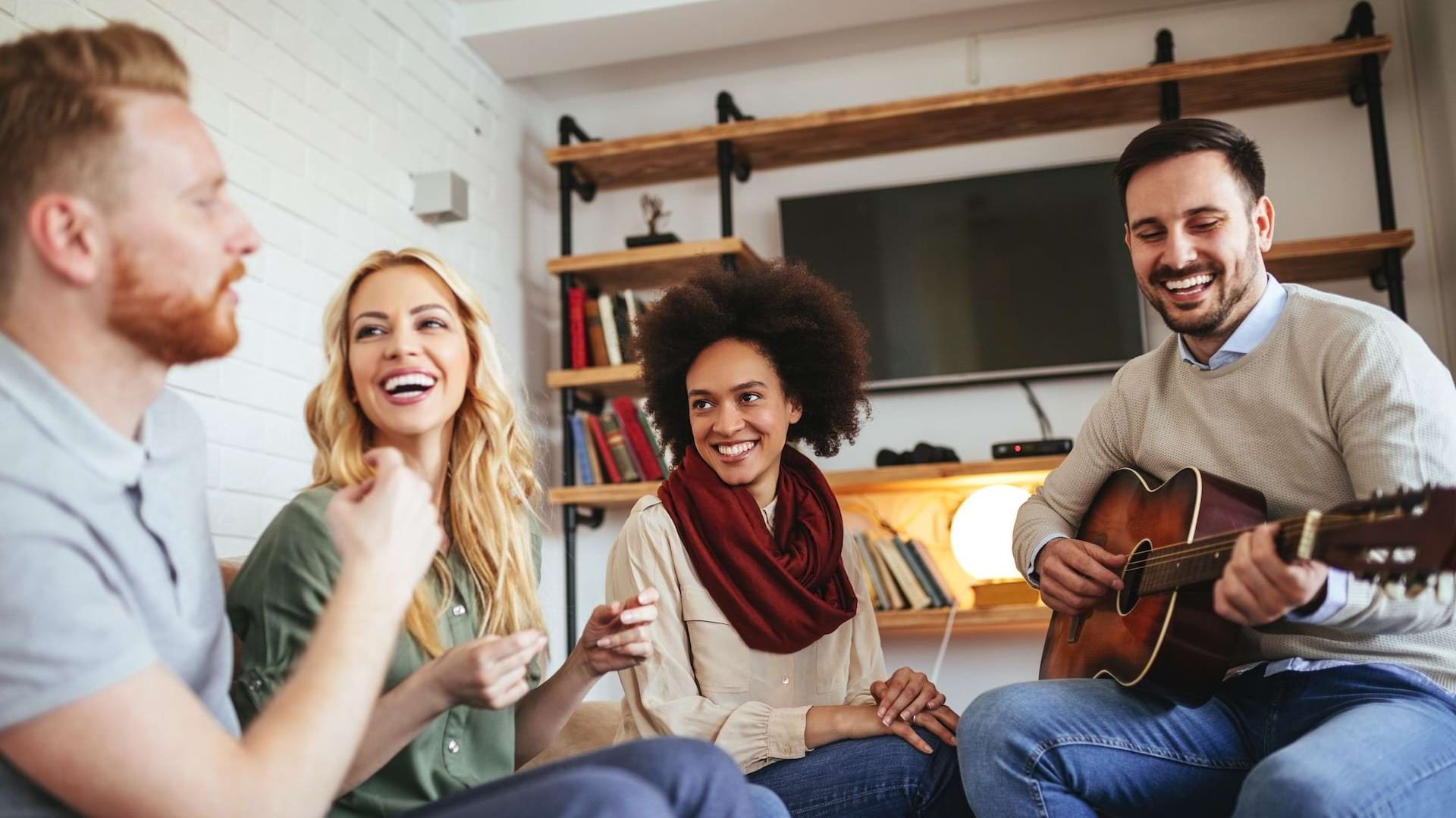 friends hanging out and playing guitar