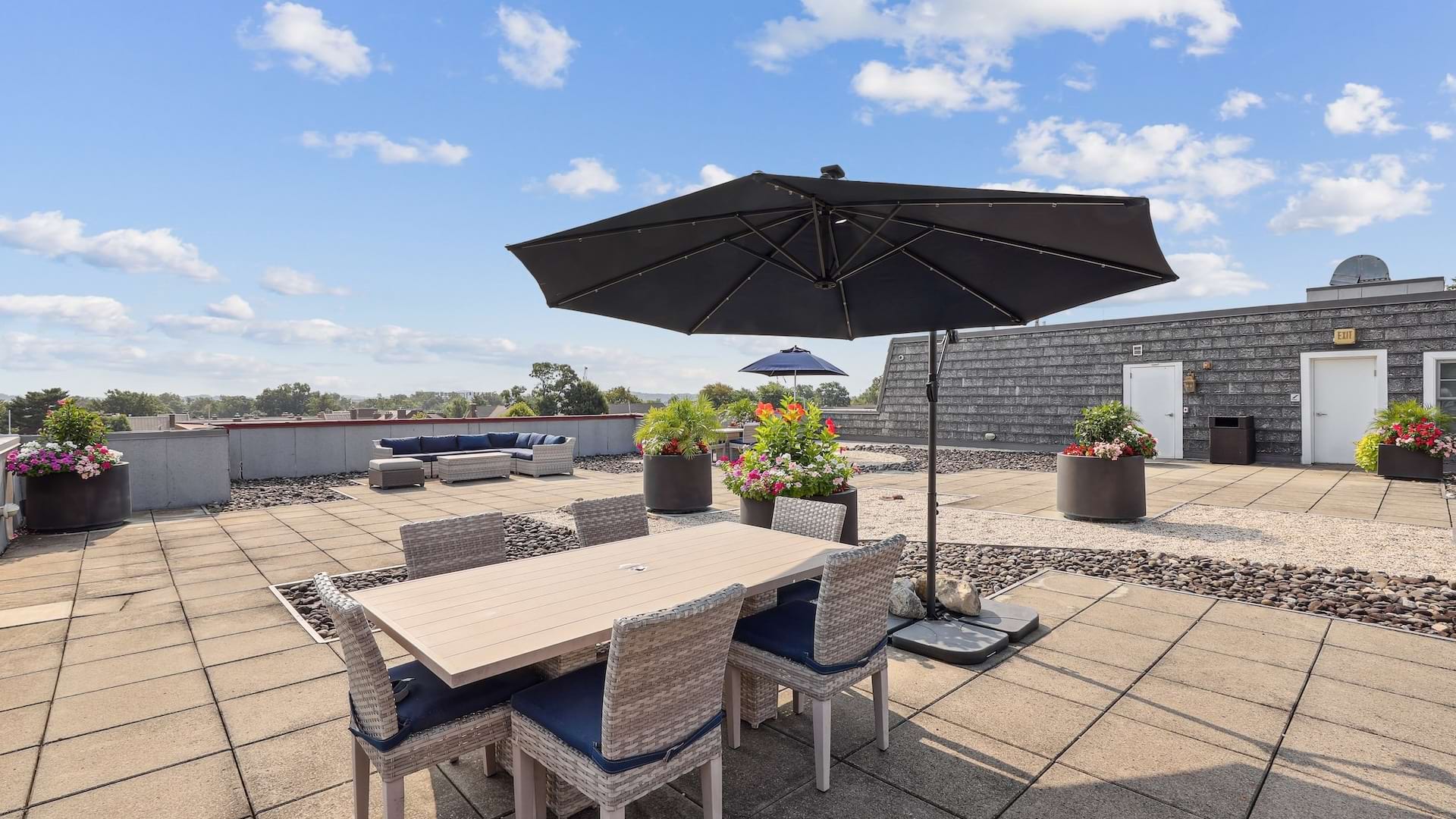Rooftop Sundeck with Shaded Tables and Seats at Our Apartments in Old Town Near Alexandria, VA