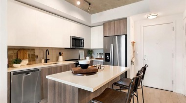 Well-Lit Kitchen with Quartz Countertops at Our Design District, Miami Apartments
