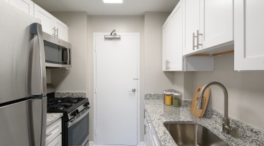 Well-lit Kitchen with Gas Cooktops at Our Georgetown University Apartments