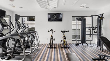 Fitness Center with an HDTV at Our Apartments in the Montrose Area