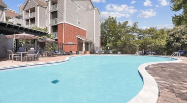 Resort-Style Pool with Lounge Chairs Nearby at Our Apartments Near the Van Dorn Metro