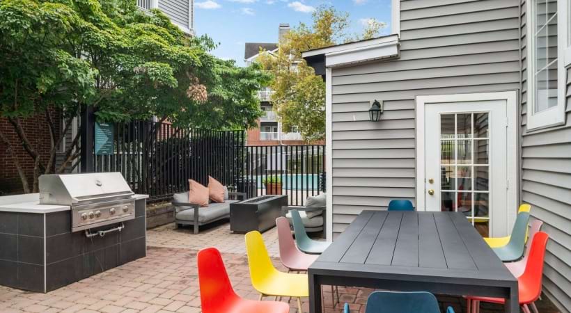 Gas Grills with a Seating Area Nearby at Our Van Dorn Street Apartments