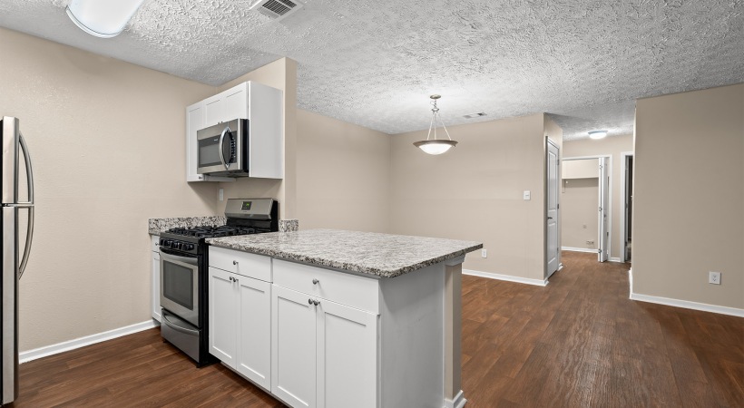 Open Floor Plan Kitchen with Granite Countertops at Our Apartments for Rent in Marietta, GA