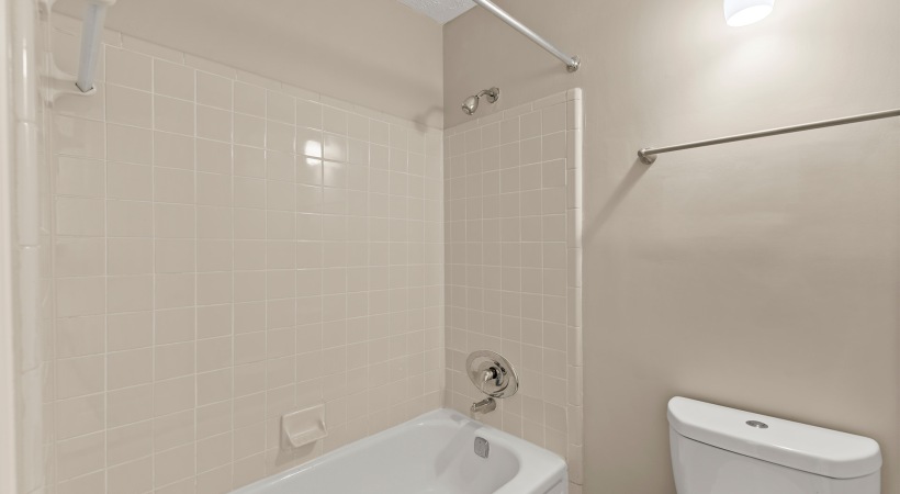 Well-Lit Bathroom with Bathtub at Our Apartments Near Marietta