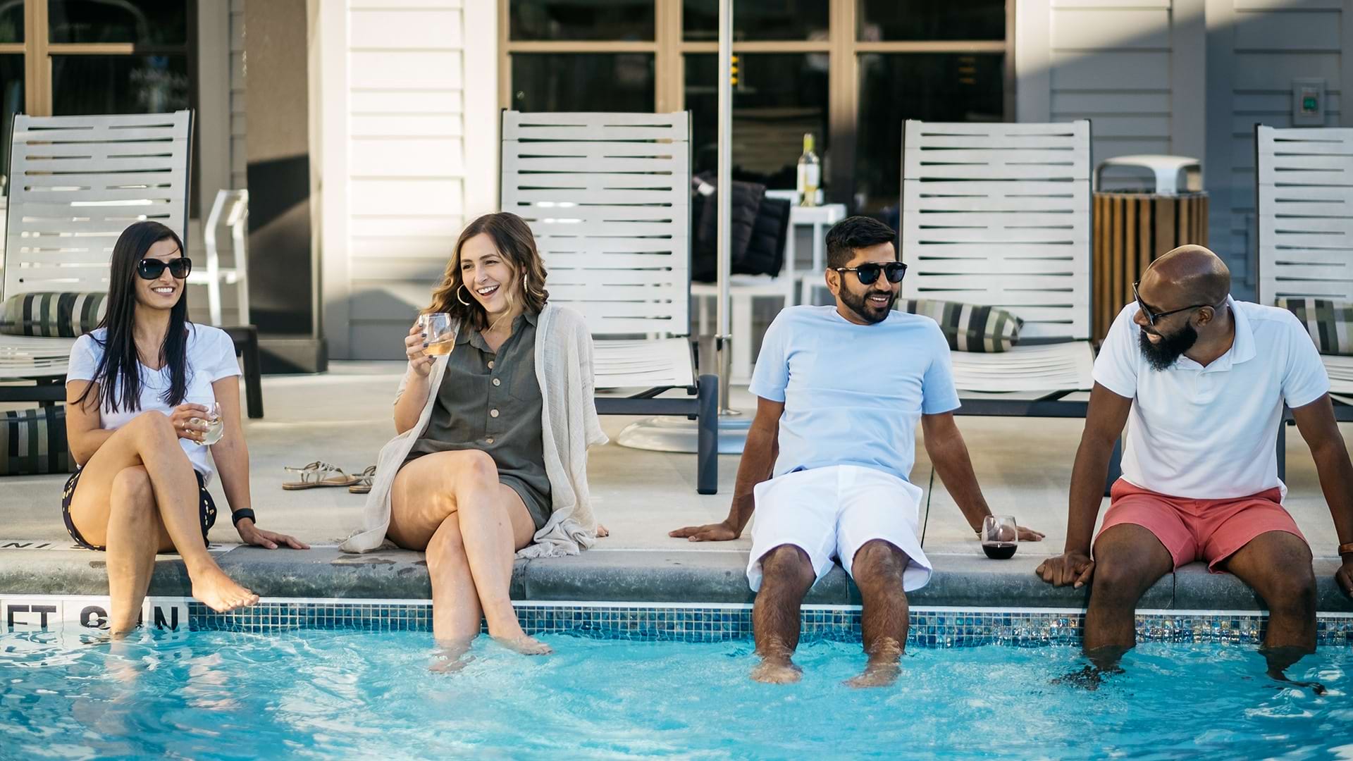 Cortland Apartment Residents Chatting in Our Pool