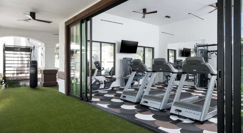 Cardio Equipment at the 24/7 Fitness Center with an Outdoor Workout Area and Yoga/Spin Studio at Our East Mesa Apartment Community