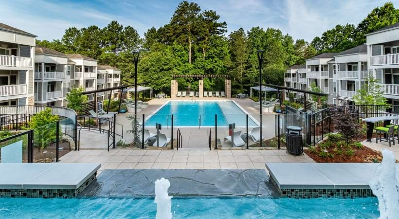 Newly Renovated Resort Style Pool and Sun Deck with Lounge Chairs at Our Apartments in East Cobb Near Marietta