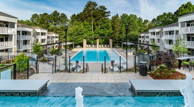 Newly Renovated Resort Style Pool and Sun Deck with Lounge Chairs at Our Apartments in East Cobb Near Marietta