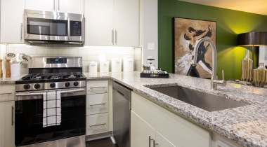 Upscale Apartment Kitchen with Energy-Efficient Stainless Steel Appliances at Our Apartments Near Marietta Square