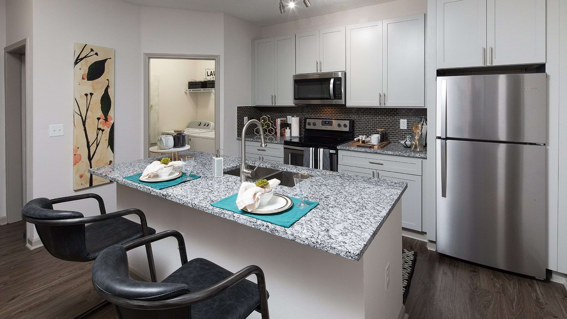 Spacious Kitchen and Dining Area at Our River Falls Apartments